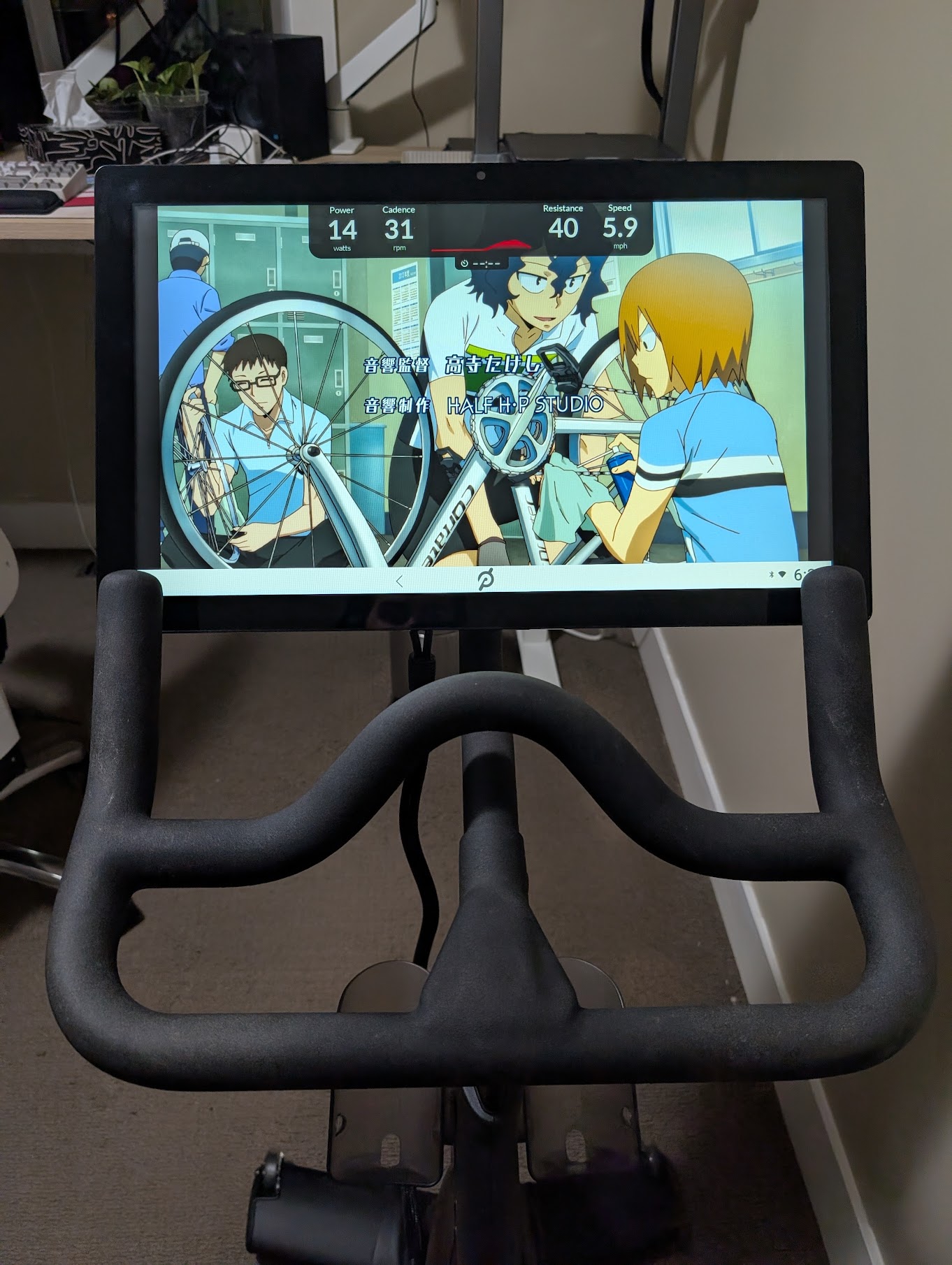 Yowamushi Pedal playing on a Pelaton bike